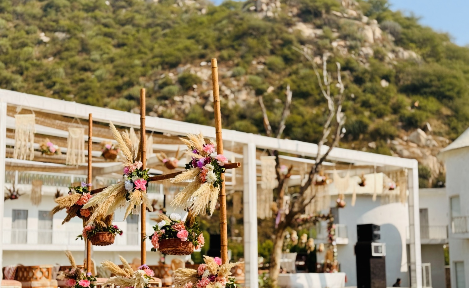 Boho-Mehendi-Decor-Setup-with-Pampas-Grass-and-Floral-Hanging-Elements-Outdoor-04092026