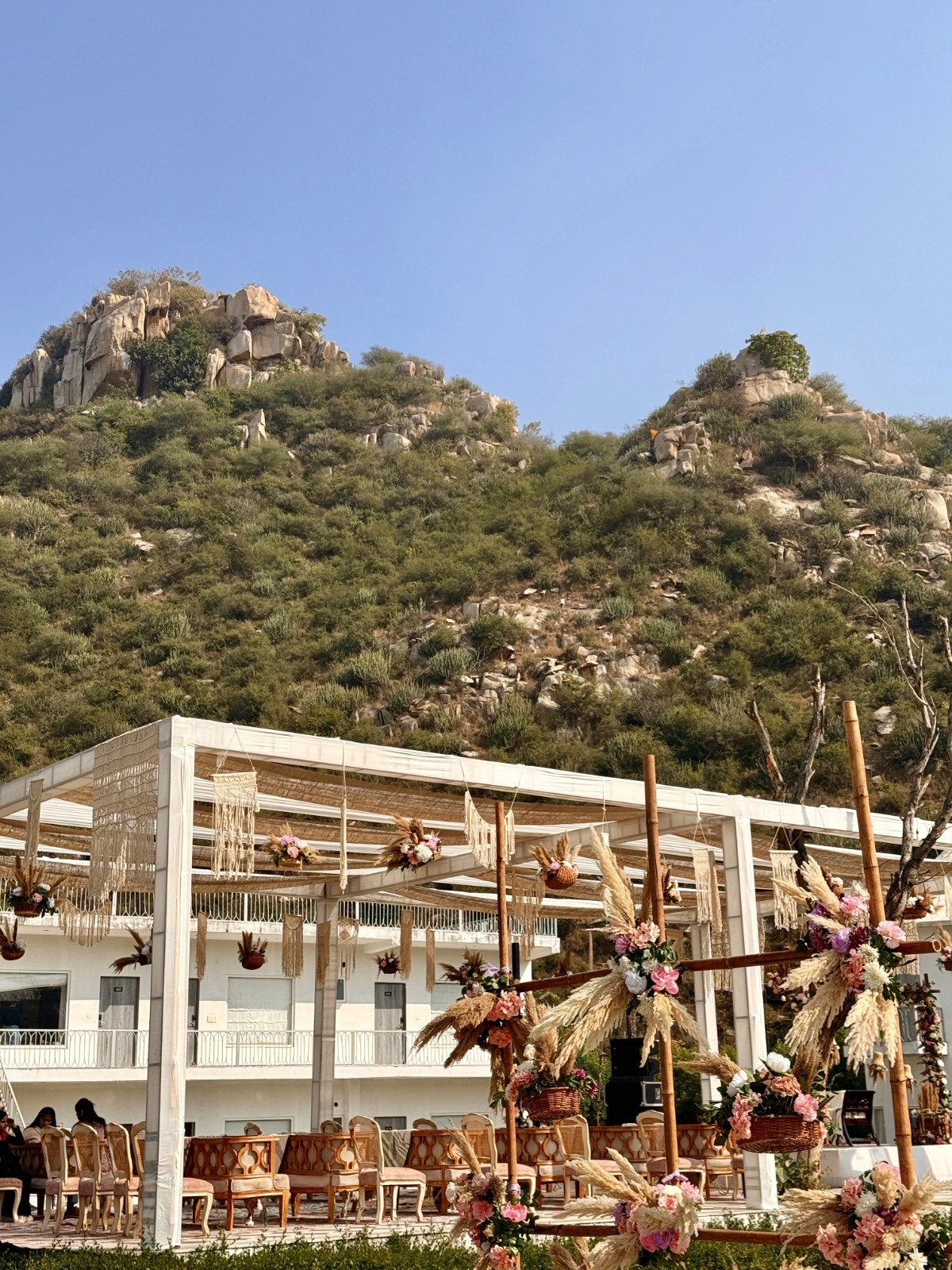 Boho-Mehendi-Outdoor-Decor-Setup-with-Pampas-Grass-Macrame-and-Floral-Elements-04092026