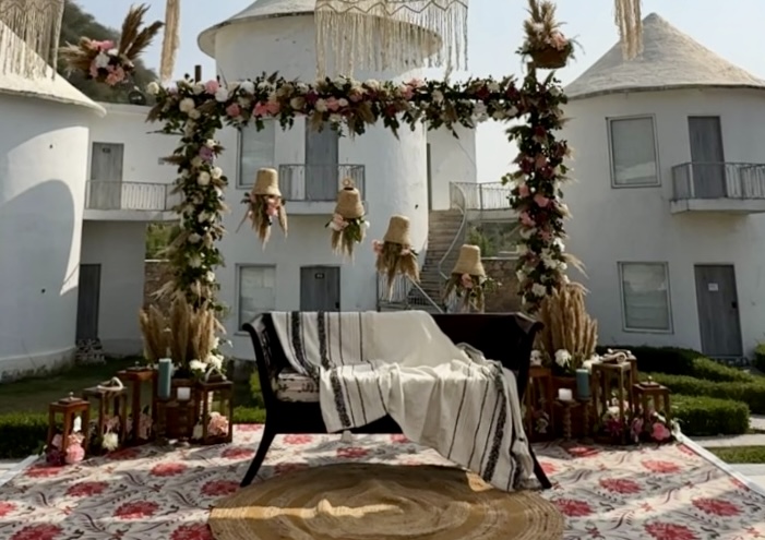 Boho-Mehendi-Stage-Setup-Close-Up-with-Floral-Arch-and-Rustic-Styling-04092026