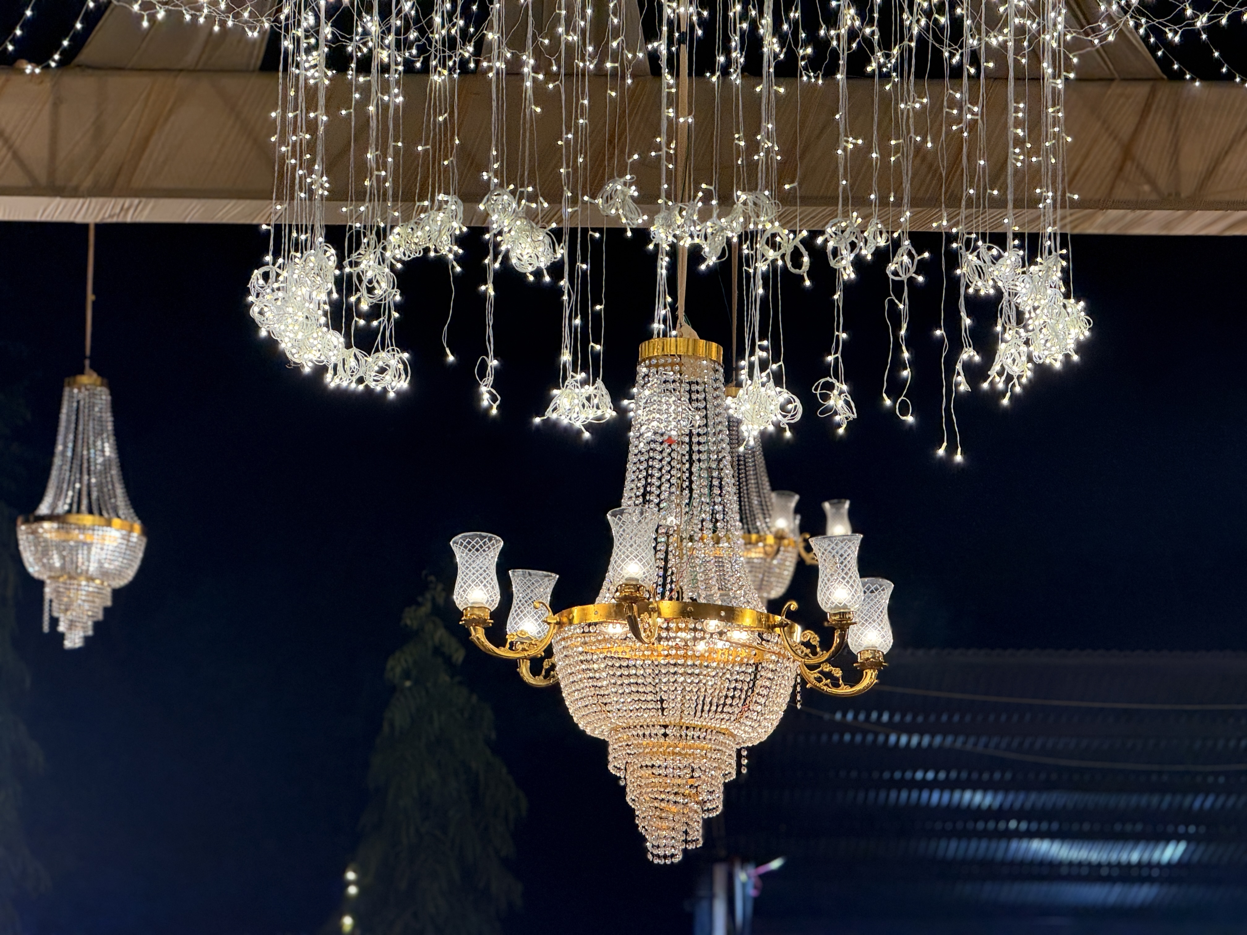 Crystal-Wedding-Chandelier-Close-Up-With-Decorative-Lighting-Setup-Wedifys-03272026