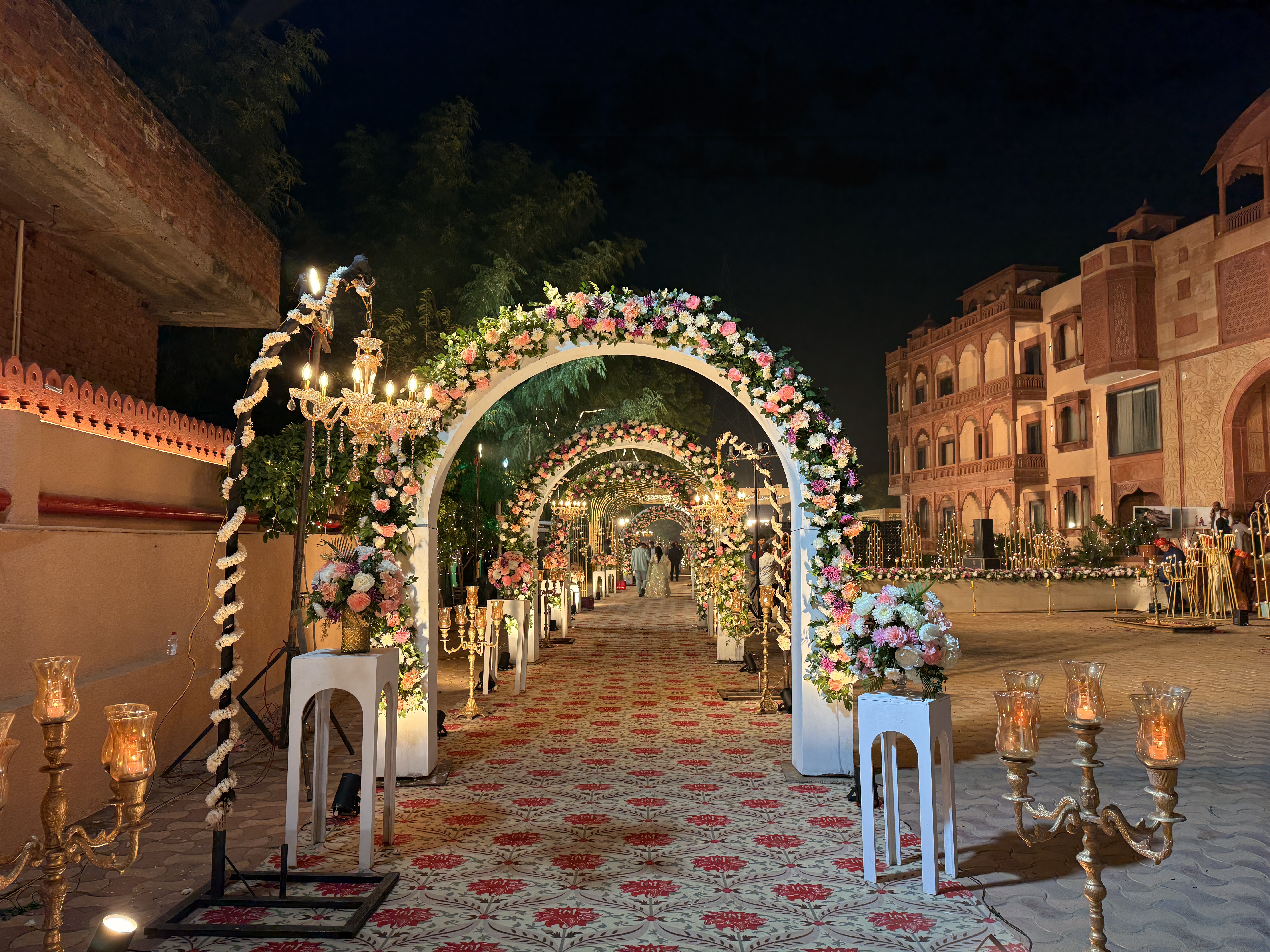 Floral-Wedding-Entry-Arch-With-Candle-Decor-And-Lighting-Setup-Wedifys-Wedding-Planner-03272026