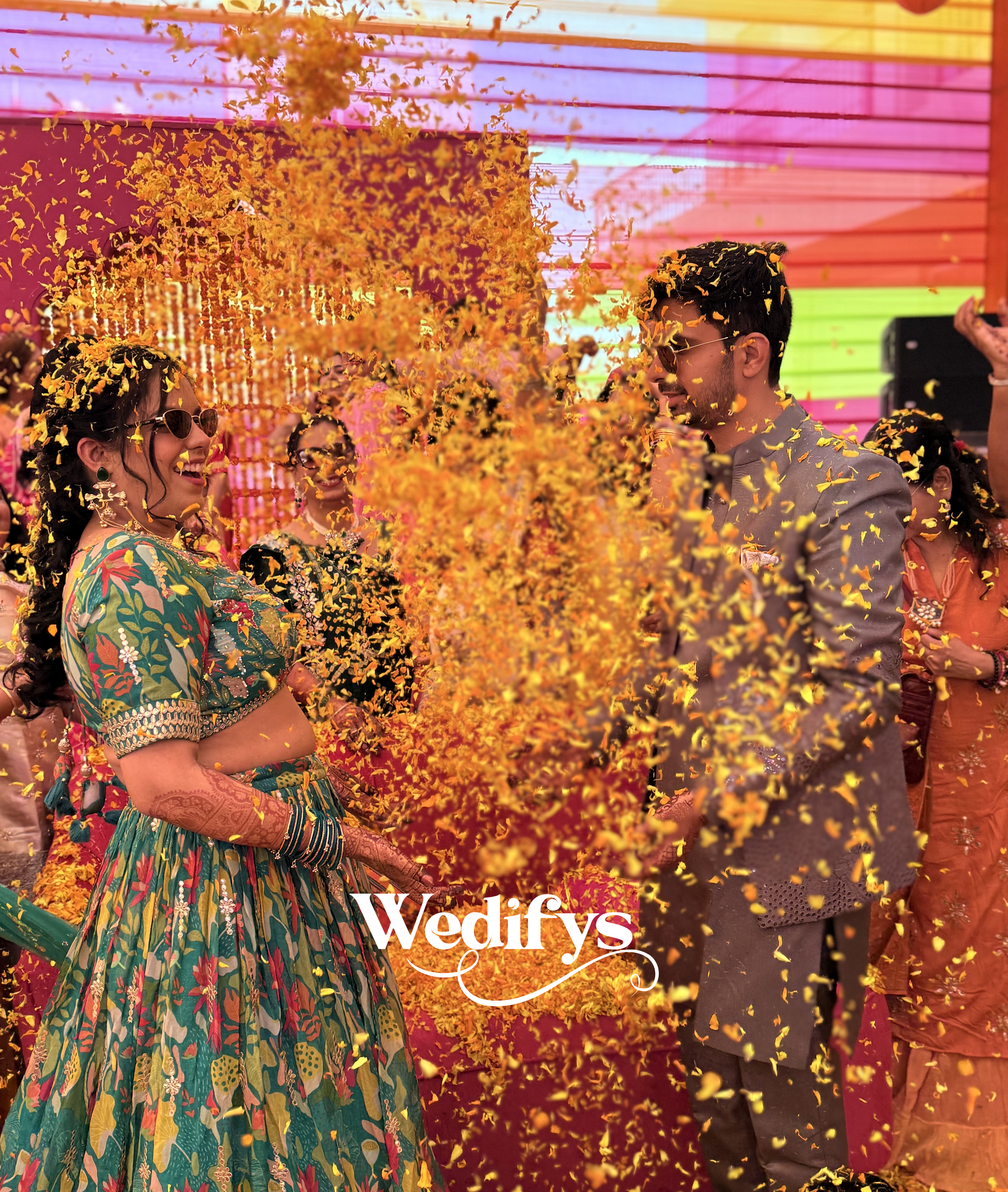 Fun-Haldi-Celebration-Couple-Playing-with-Flower-Petals-04272026