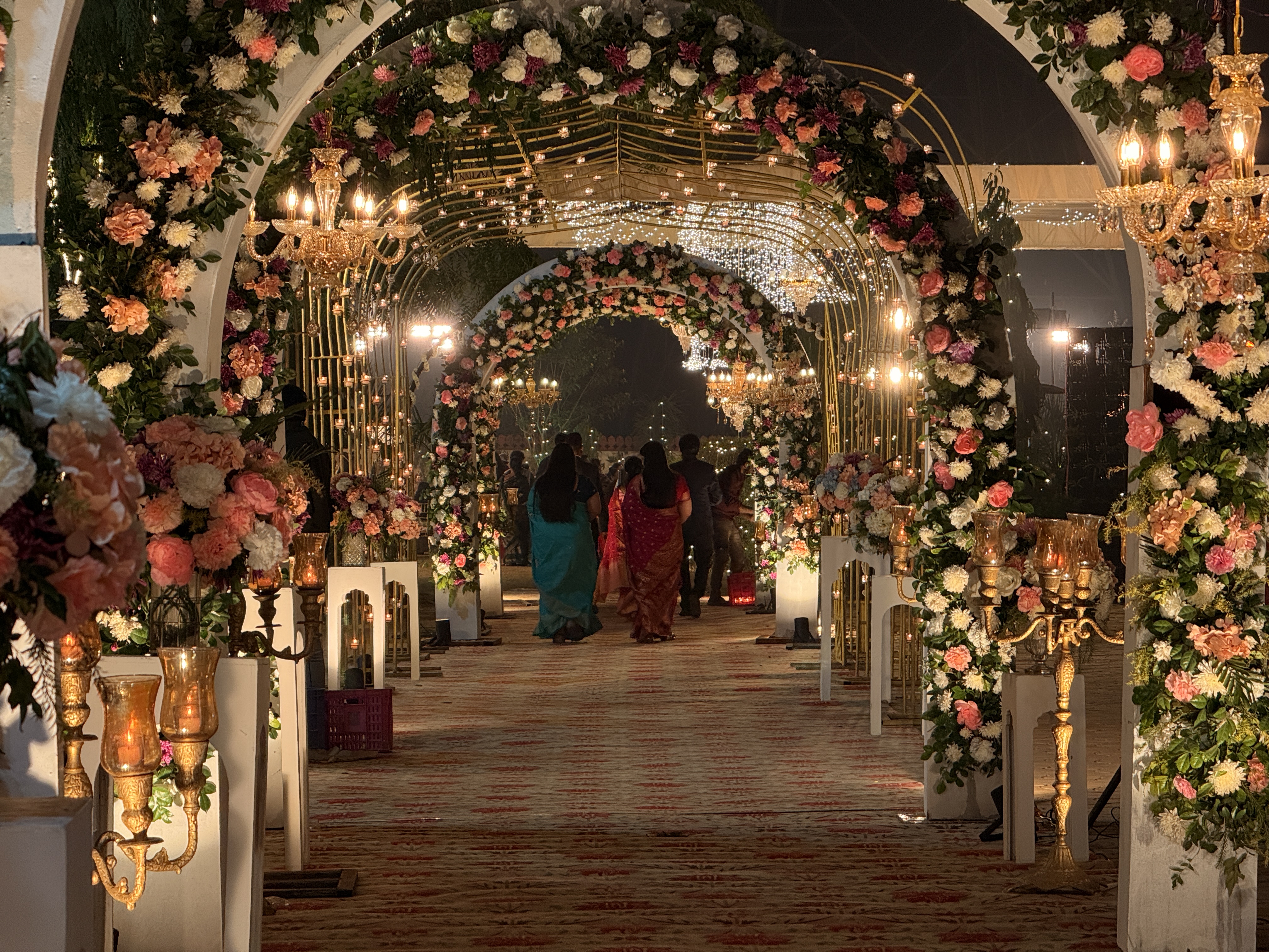 Grand-Wedding-Walkway-With-Multiple-Floral-Arches-And-Lights-03272026