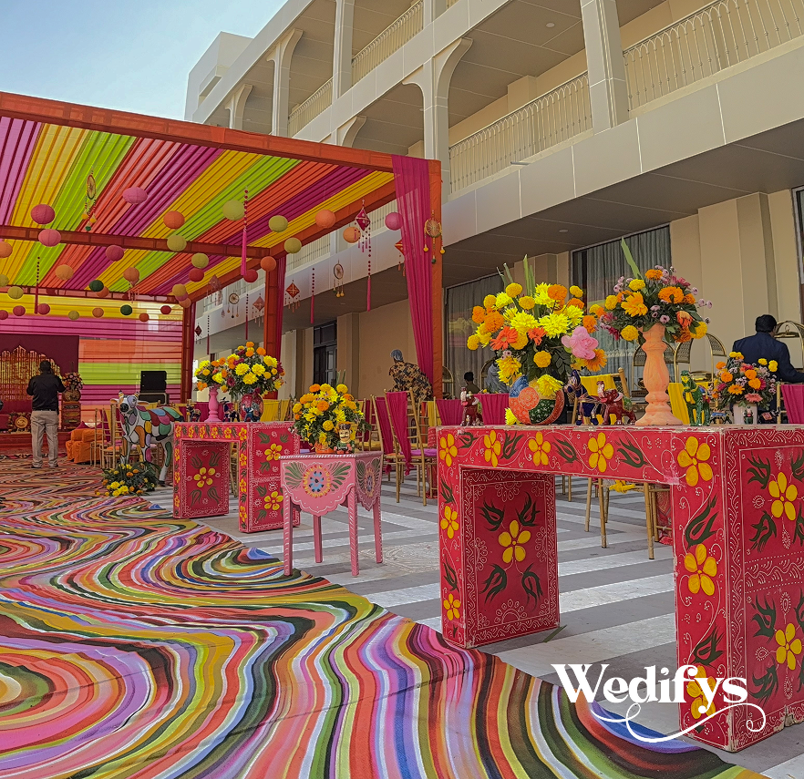 Haldi-Table-Decor-with-Floral-Arrangements-and-Colorful-Rajasthani-Styling-04242026