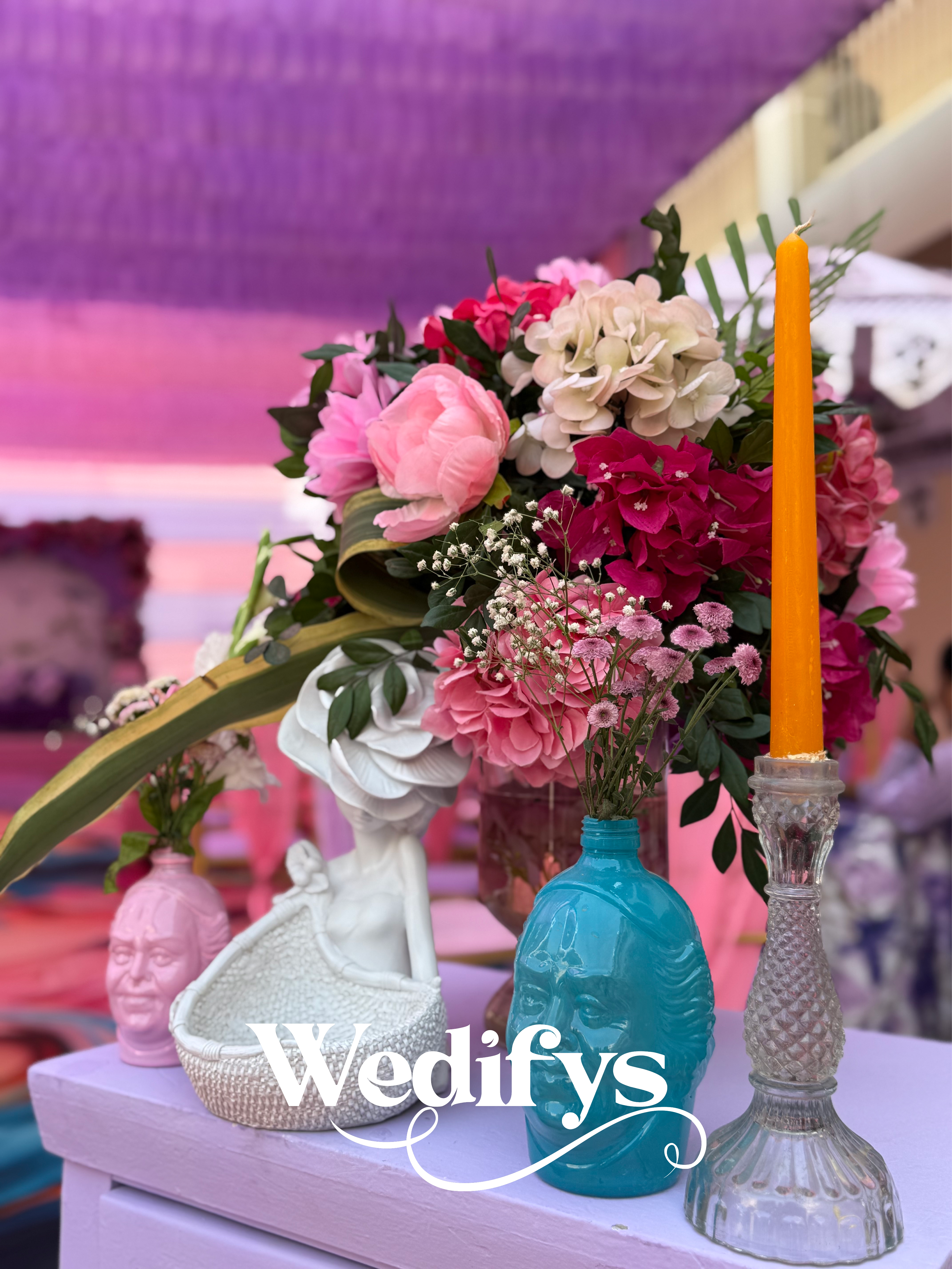 Haldi-Table-Decor-with-Pastel-Flowers-and-Mustard-Candle-Accent-04132026