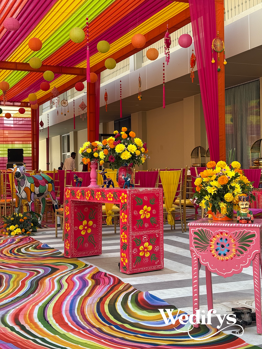 Haldi-Walkway-Decor-with-Floral-Tables-and-Vibrant-Canopy-Styling-04242026