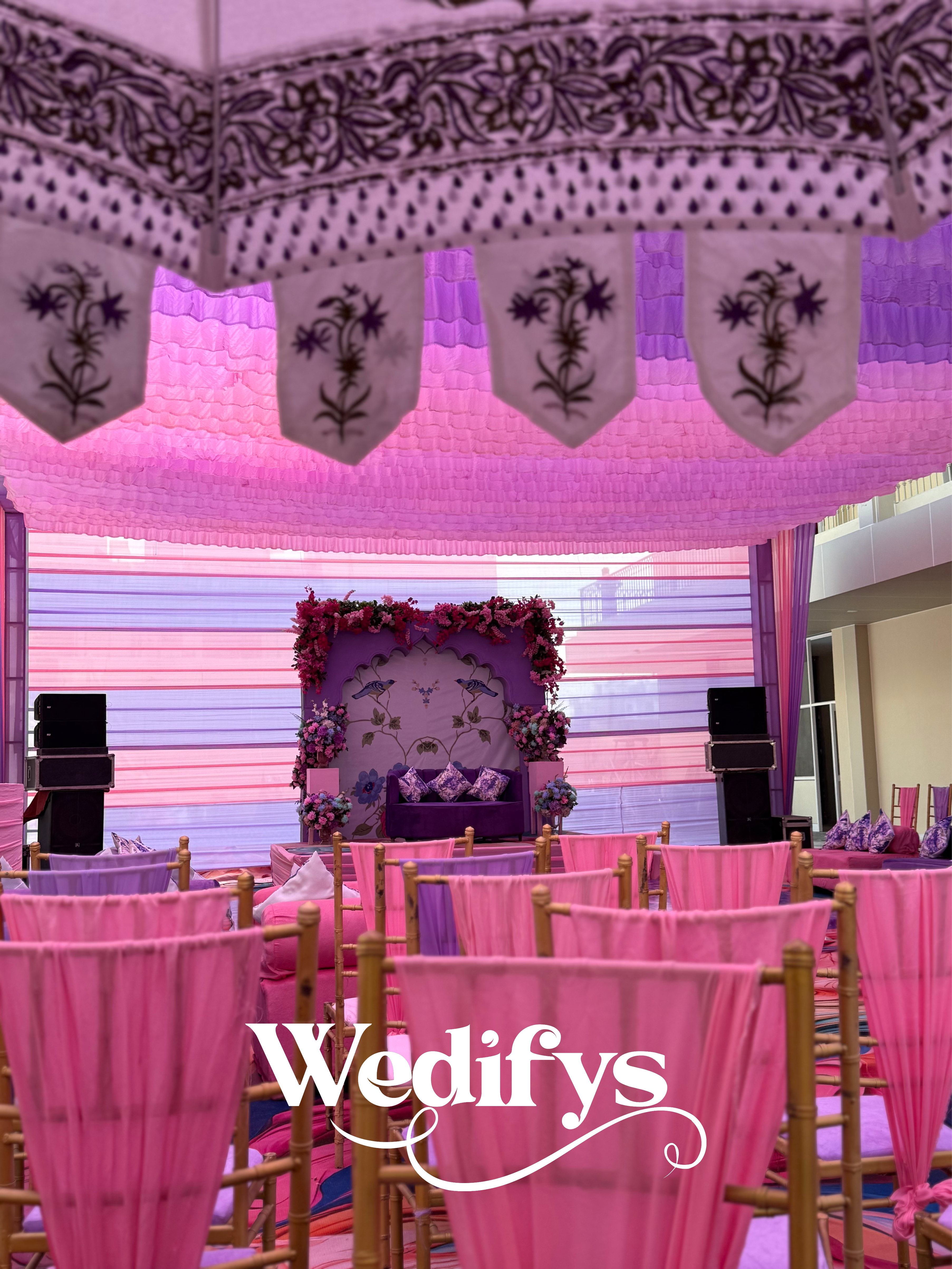 Pastel-Haldi-Stage-Setup-with-Pink-Drapes-and-Floral-Backdrop-04132026