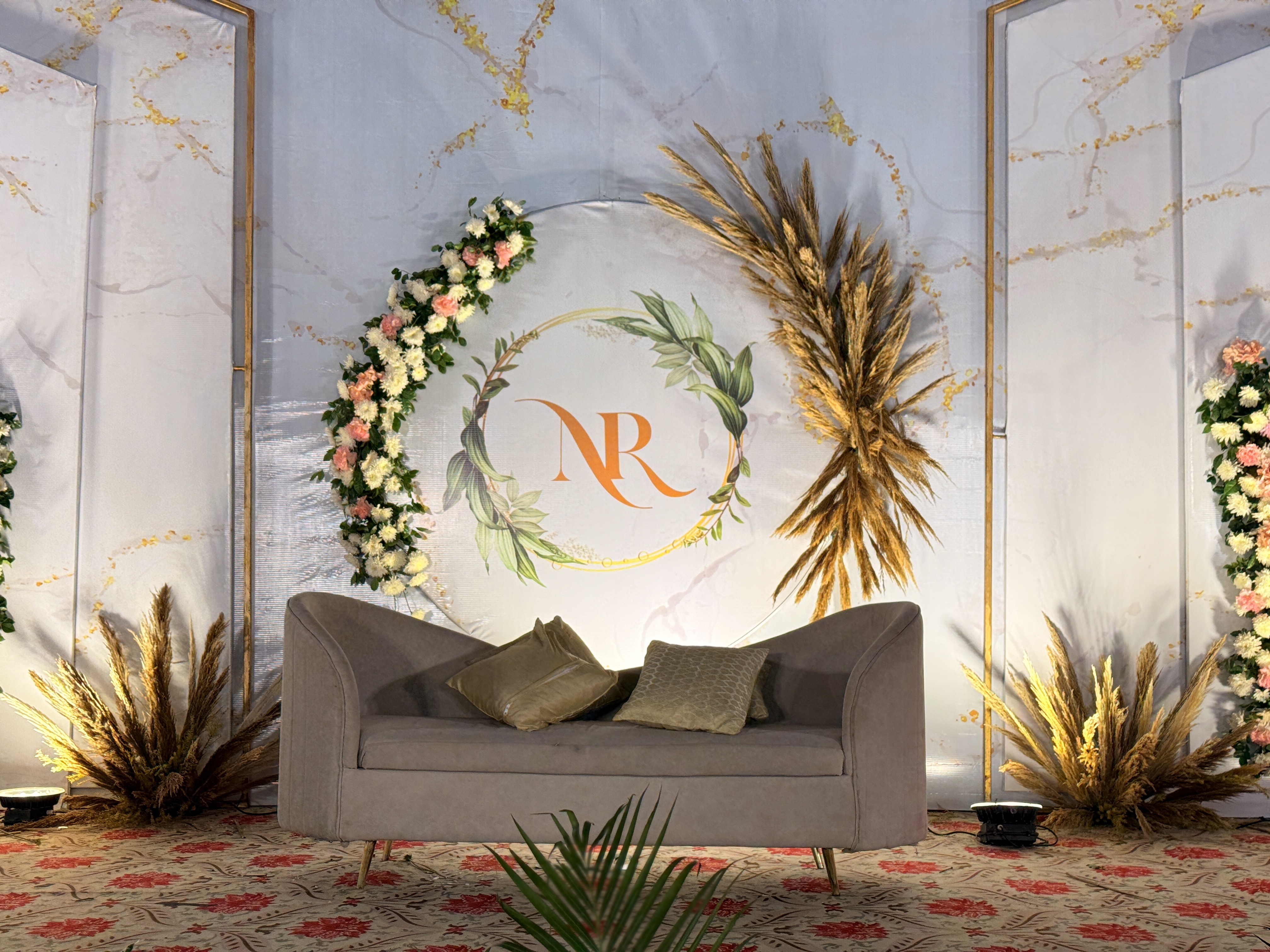 Wedding-Stage-Close-Up-With-Floral-Ring-And-Elegant-Sofa-Setup--Wedifys-Wedding-Planner-03272026